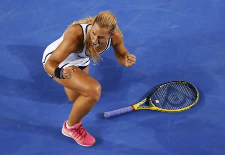 Dominika Cibulkova of Slovakia celebrates after defeating Victoria Azarenka of Belarus during their women's singles fourth round match at the Australian Open 2015 tennis tournament in Melbourne January 26, 2015. REUTERS/Carlos Barria