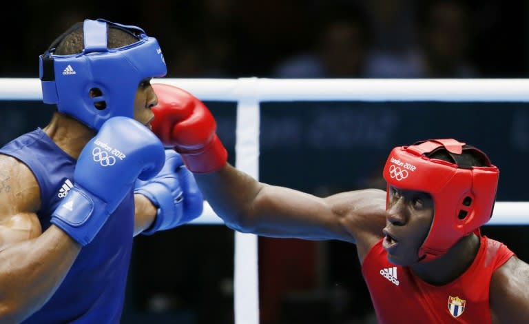 Erislandy Savon Cotilla (R) of Cuba fights Anthony Joshua (L) of Great Britan at the London 2012 Olympics