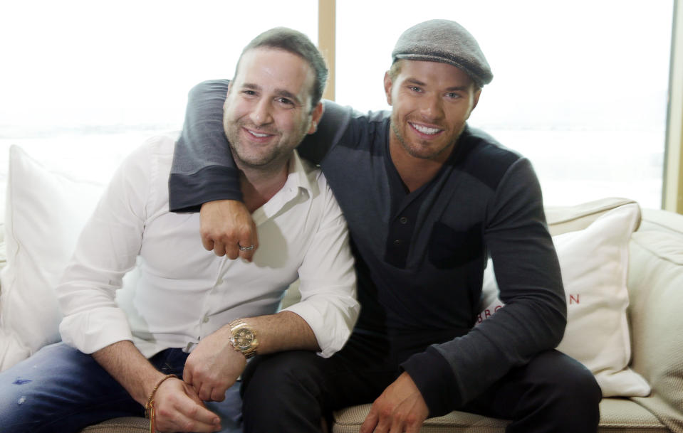 Actor-designer Kellan Lutz, right, and his business partner Danny Guez pose for a portrait to promote their clothing line Abbot + Main's pre-spring 2014 collection at the Mandalay Bay Hotel on Monday, Aug. 19, 2013 in Las Vegas. (Photo by Isaac Brekken/Invision/AP)