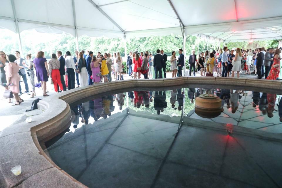 The crowd stayed dry under the tent.