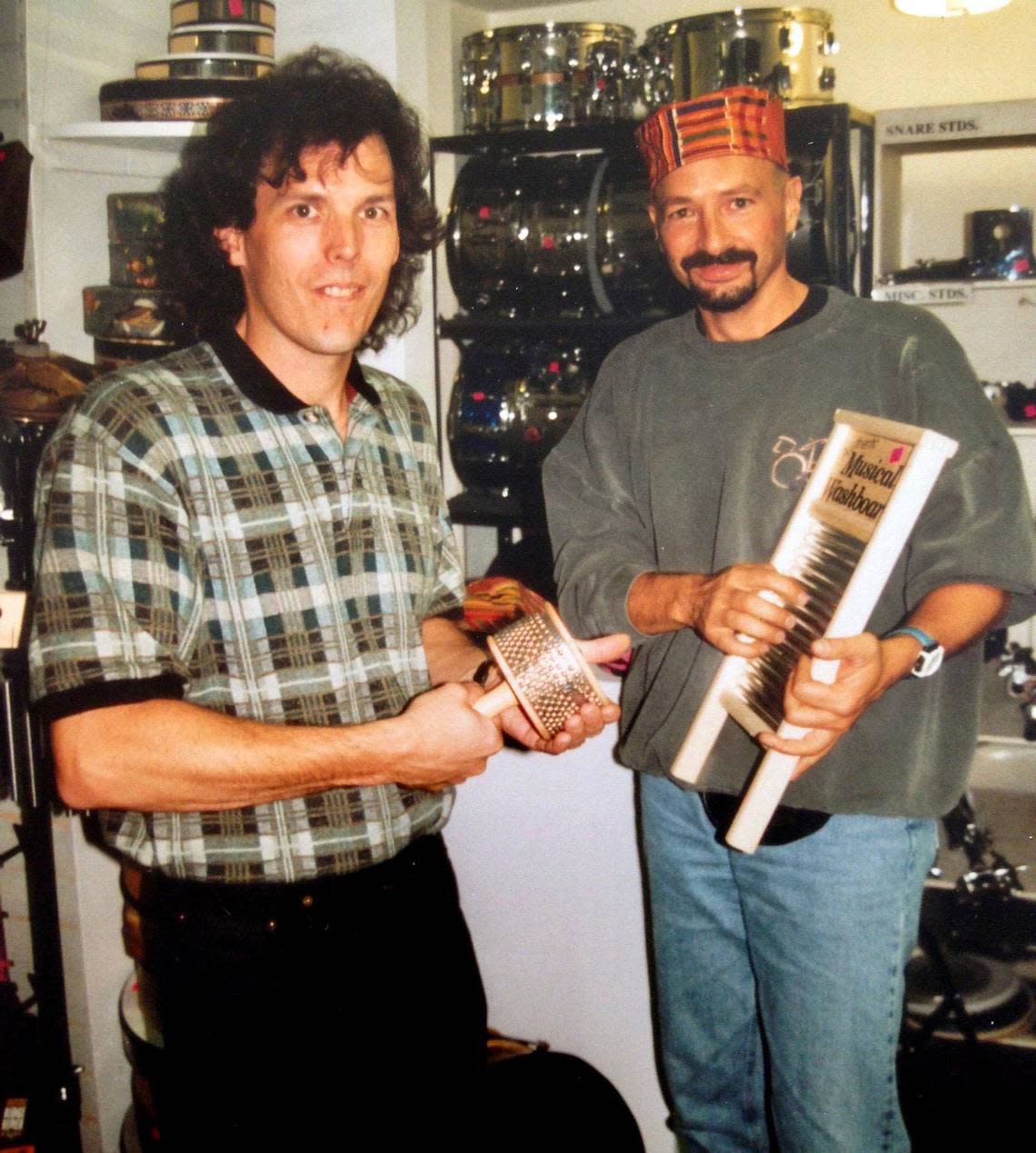 Explorers Percussion owner Wes Faulconer, left, with Journey drummer Steve Smith.