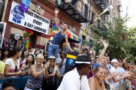 NEW YORK - JUNE 24: Revelers celebrate during the New York City Gay Pride March on June 24, 2012 in New York City. The annual civil rights demonstration commemorates the Stonewall riots of 1969, which erupted after a police raid on a gay bar, the Stonewall Inn on Christopher Street. (Photo by Michael Nagle/Getty Images)