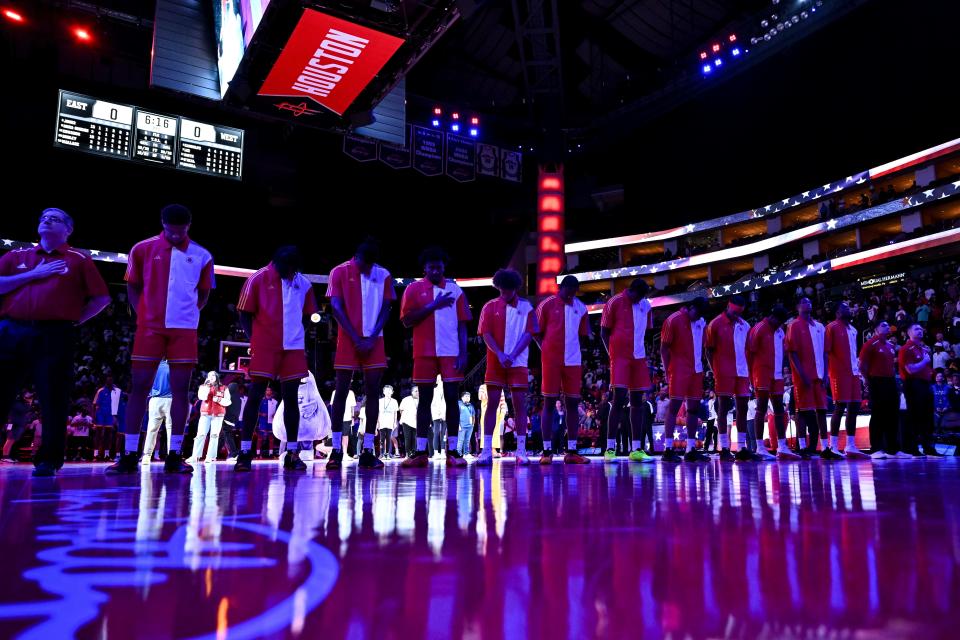 Apr 2, 2024; Houston, TX, USA; McDonald's All American West stand during the National Anthem prior to the game against the McDonald's All American East at Toyota Center. Mandatory Credit: Maria Lysaker-USA TODAY Sports