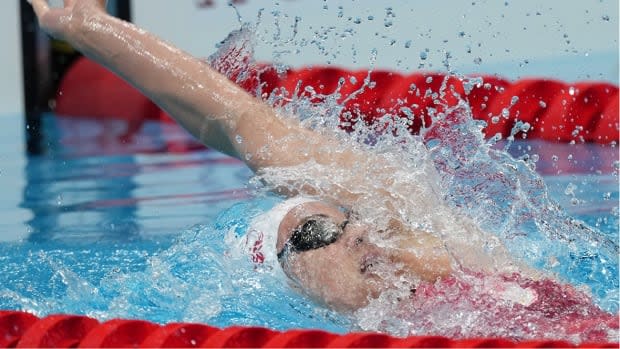 Canadian swimmer Kylie Masse, pictured, finished in a second-place tie with American Rhyan White in qualifying for the women's 200-metre backstroke semifinals, scheduled for Thursday at 10:35 p.m. ET. Australia's Kaylee McKeown was tops in 2:08.18. (Jack Gruber/USA TODAY Sports via Reuters - image credit)