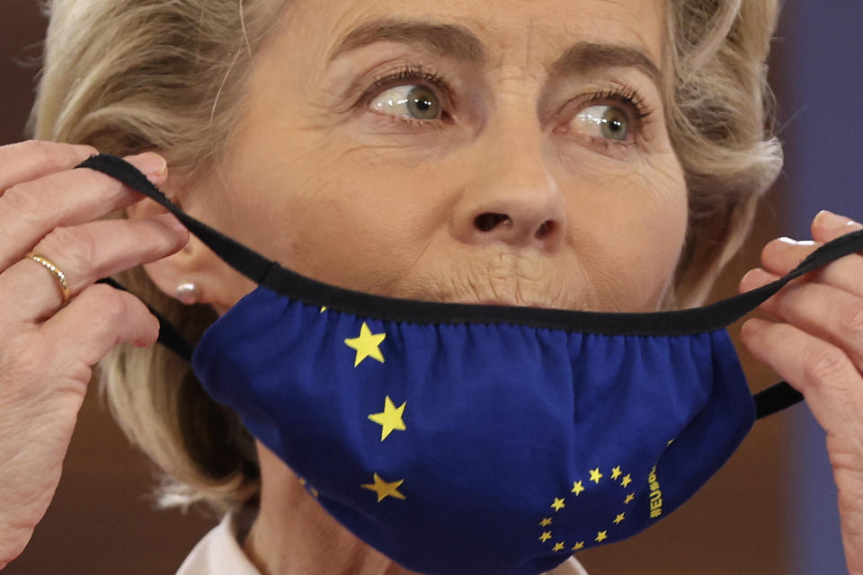 European Commission President Ursula von der Leyen puts on her protective face mask during a media conference at an EU summit in Porto, Portugal, Saturday, May 8, 2021. On Saturday, EU leaders held an online summit with India's Prime Minister Narendra Modi, covering trade, climate change and help with India's COVID-19 surge. (AP Photo/Luis Vieira)