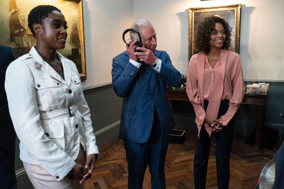 IVER HEATH, ENGLAND - JUNE 20: Prince Charles, Prince of Wales meets British actors Lashana Lynch (L) and Naomie Harris (R) as he tours the set of the 25th James Bond Film at Pinewood Studios on June 20, 2019 in Iver Heath, England.  The Prince of Wales, Patron, The British Film Institute and Royal Patron, the Intelligence Services toured the set of the 25th James Bond Film to celebrate the contribution the franchise has made to the British film industry. (Photo by Niklas Halle'n - WPA Pool/Getty Images)