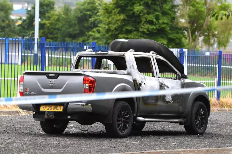 The burnt out vehicle near Poulton Victoria Sports & Social Club, Wallasey