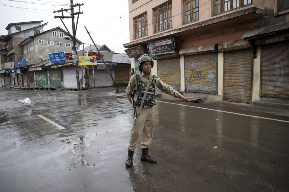 An Indian paramilitary soldier stands guard during security lockdown in Srinagar, Indian controlled Kashmir, Wednesday, Aug. 14, 2019. India has maintained an unprecedented security lockdown to try to stave off a violent reaction to Kashmir's downgraded status. Protests and clashes have occurred daily, thought the curfew and communications blackout have meant the reaction is largely subdued. (AP Photo/ Dar Yasin)