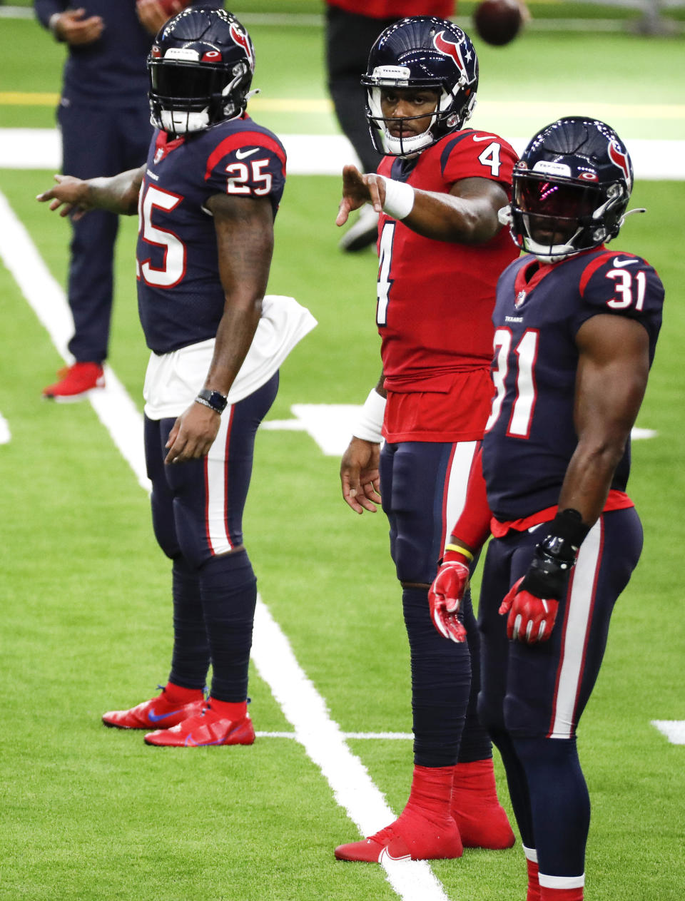 Houston Texans quarterback Deshaun Watson (4) calls out signals as he lines up with running backs Duke Johnson (25) and David Johnson (31) during NFL football training camp Thursday, Aug. 27, 2020, in Houston. (Brett Coomer/Houston Chronicle via AP, Pool)