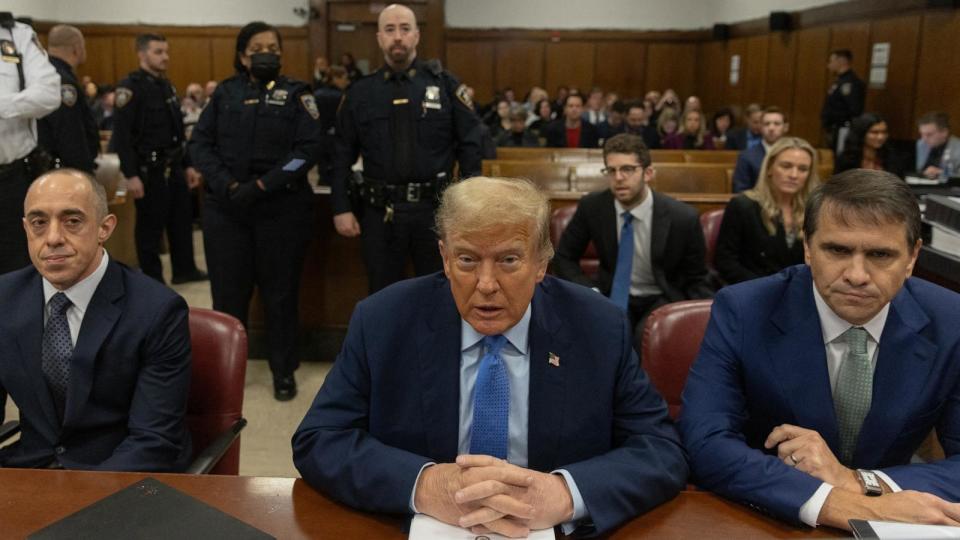 PHOTO: Former President Donald Trump (C), sitting with attorneys Emil Bove (L) and Todd Blanche (R), attends his trial at Manhattan Criminal Court in New York City on April 26, 2024. (Jeenah Moon/POOL/AFP via Getty Images)