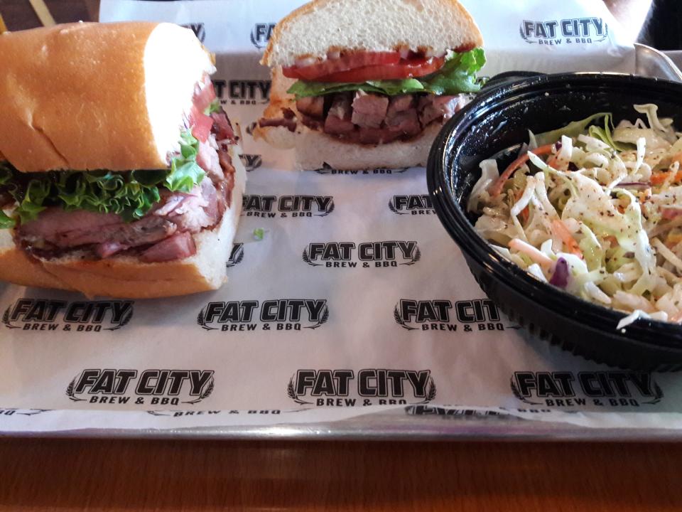 Fat City Brew & BBQ's rib sandwich with a side of coleslaw.