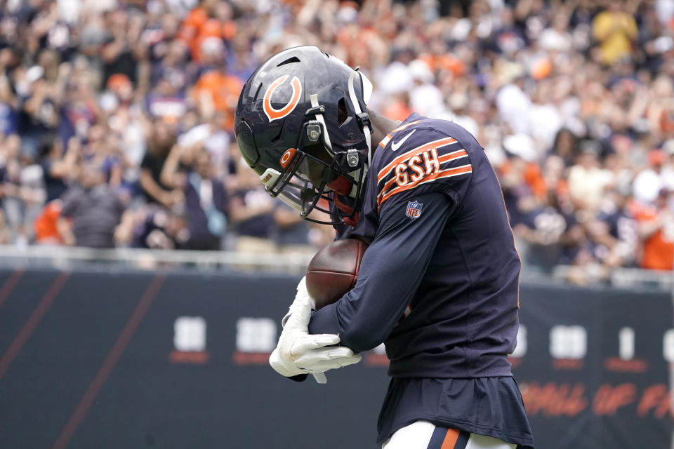 Chicago Bears wide receiver Rodney Adams rocks the football like a baby in his arms after catching a touchdown pass from quarterback <a class="link " href="https://sports.yahoo.com/nfl/players/24822" data-i13n="sec:content-canvas;subsec:anchor_text;elm:context_link" data-ylk="slk:Andy Dalton;sec:content-canvas;subsec:anchor_text;elm:context_link;itc:0">Andy Dalton</a> during the first half of an NFL preseason football game against the <a class="link " href="https://sports.yahoo.com/nfl/teams/buffalo/" data-i13n="sec:content-canvas;subsec:anchor_text;elm:context_link" data-ylk="slk:Buffalo Bills;sec:content-canvas;subsec:anchor_text;elm:context_link;itc:0">Buffalo Bills</a> Saturday, Aug. 21, 2021, in Chicago. (AP Photo/David Banks)