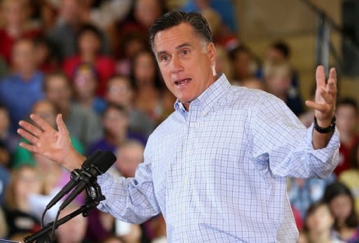 Republican presidential candidate Mitt Romney speaks during campaign event at the Jefferson County Fairgrounds in Golden, Colorado. President Barack Obama slammed Romney's "fairy dust" tax cuts, claiming his millionaire Republican foe would swell his own wealth while sticking the middle class with the bill