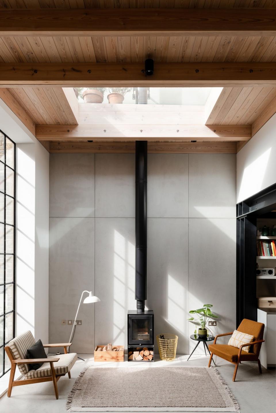 “My husband’s very keen on quite traditional wood furniture, and I quite like the juxtaposition of that with this modern, minimal space," says Leo.