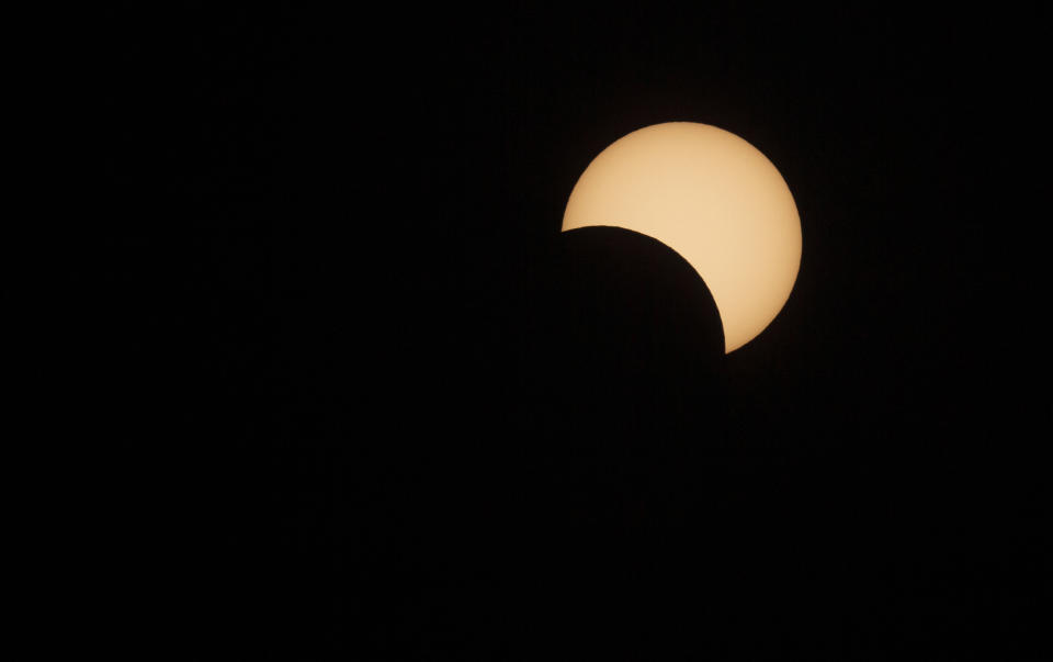 The moon passes in front of the sun during a solar eclipse in La Higuera, Chile, July 2, 2019. (Photo: Esteban Felix/AP)