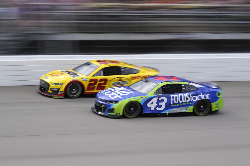 Erik Jones (43) and Joey Logano (22) race in the NASCAR Cup Series auto race at the Michigan International Speedway in Brooklyn, Mich., Sunday, Aug. 7, 2022. (AP Photo/Paul Sancya)