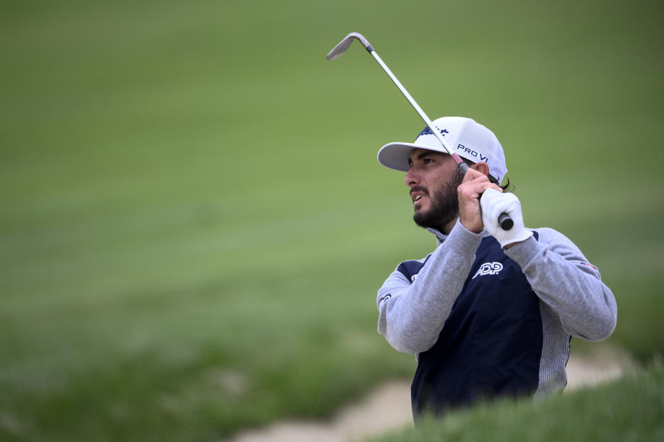 Max Homa hits from the bunker on the 14th hole during the final round of the Wells Fargo Championship golf tournament, Sunday, May 8, 2022, at TPC Potomac at Avenel Farm golf club in Potomac, Md. (AP Photo/Nick Wass)