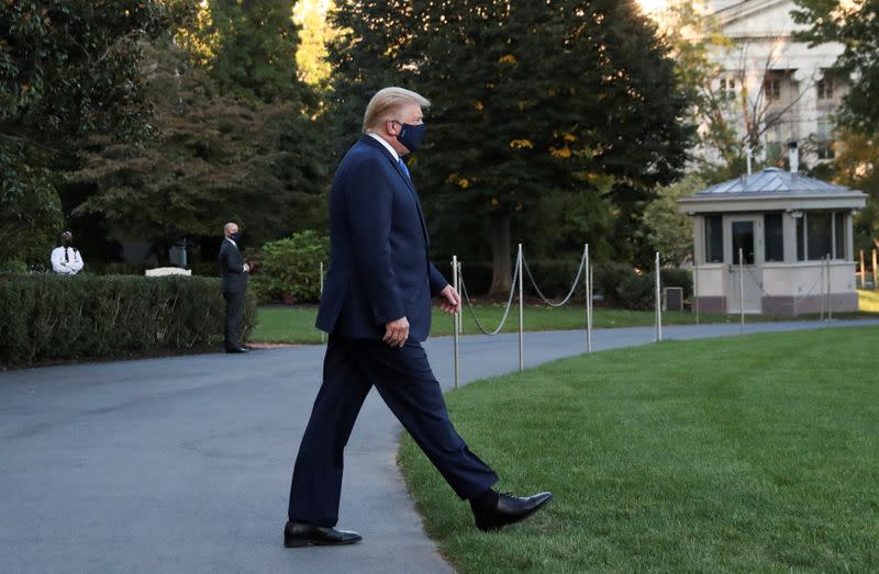 U.S. President Trump walks to the Marine One helicopter as he departs for Walter Reed Medical Center from the White House in Washington