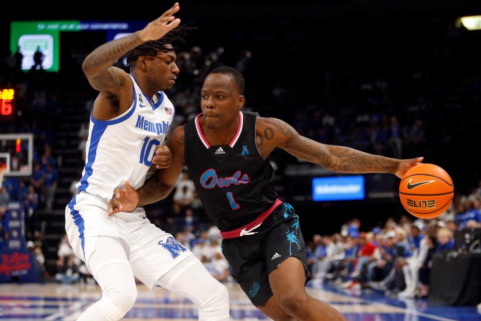 In this file photo, then-Florida Atlantic guard Johnell Davis (1) drives to the basket against Memphis guard Jaykwon Walton (10) during the second half of a game last season at FedExForum in Memphis, Tennessee .  Davis is transferring to Arkansas, where he will play for John Calipari next season.