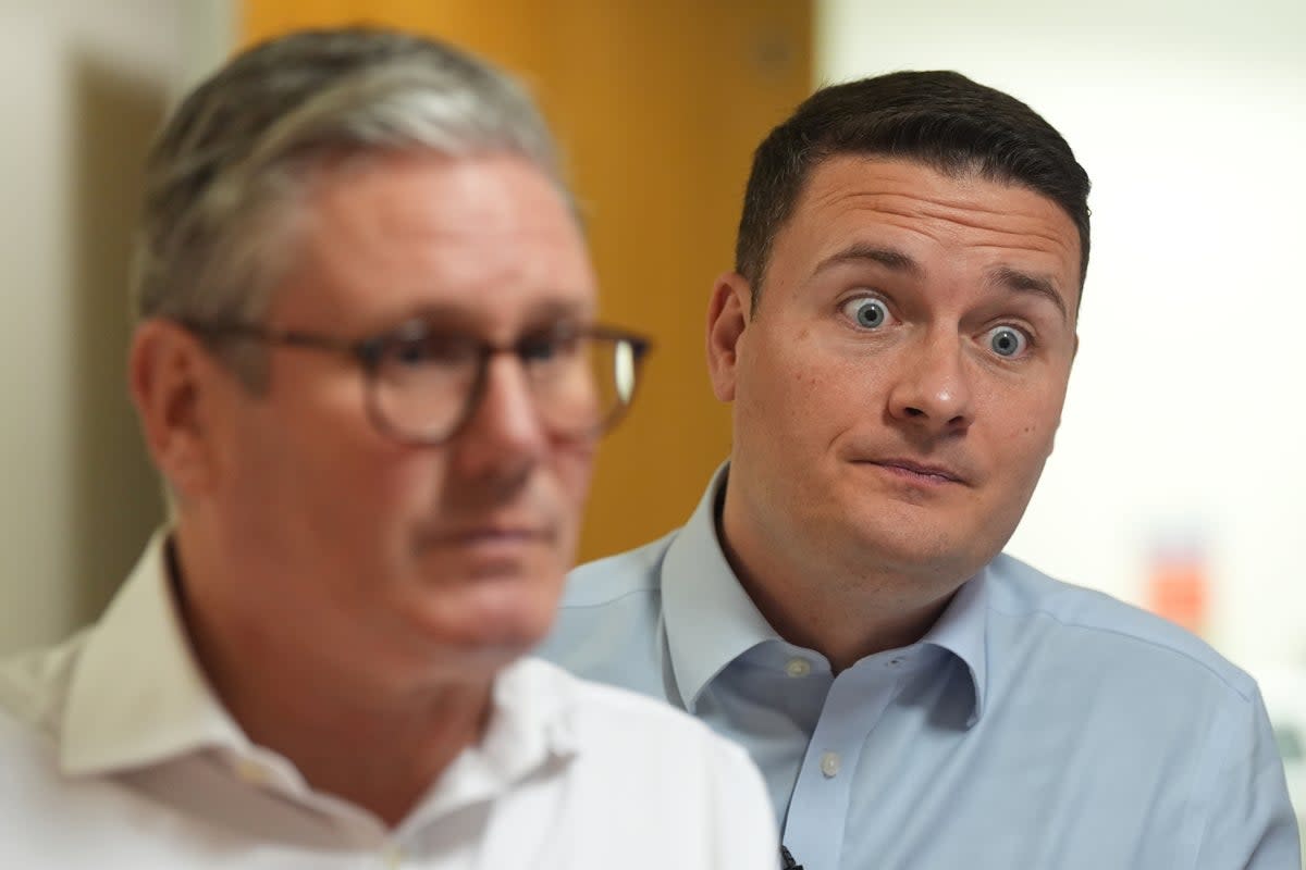 The shadow health secretary, pictured behind Keir Starmer, has spoken of his own personal brush with kidney cancer at the age of 38 (Jacob King/PA Wire)