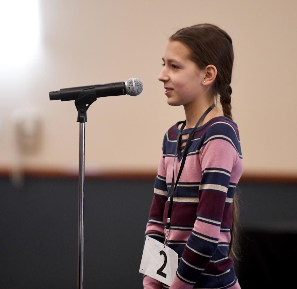 Julianne Liliestedt of Canton Country Day School spells a word during the practice round of The Canton Repository's Regional Final Spelling Bee. Liliestedt won the bee in 2022 and went on to compete in the Scripps National Spelling Bee.