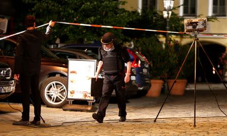 Police secure the area after an explosion in Ansbach, near Nuremberg, Germany July 25, 2016. REUTERS/Michaela Rehle