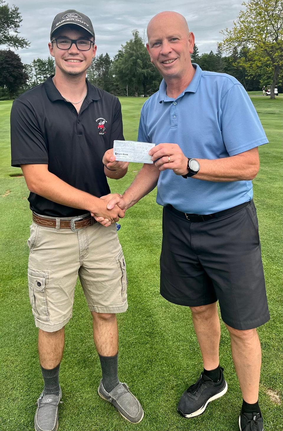 Honesdale's Lake LeClere (left) has received a $500 scholarship from the Cricket Hill Men's Golf League. Pictured here with Lake is Hornet Head Coach Mike Miller (right)