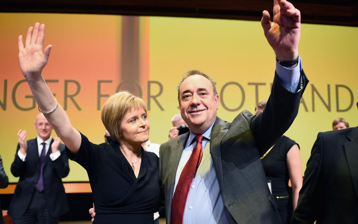 Alex Salmond and Nicola Sturgeon arm in arm - Jeff J Mitchell/Getty Images Europe