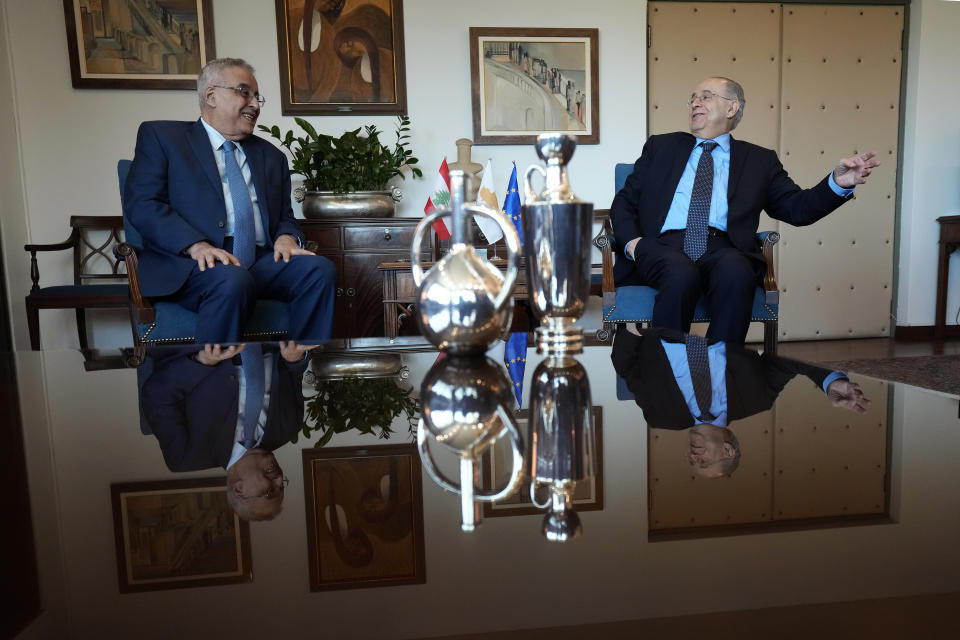 Cyprus' foreign minister Ioannis Kasoulides, right, and his Lebanese counterpart Abdallah Bou Habib talk during their meeting at the foreign ministry house in Nicosia, Cyprus, Friday, April 15, 2022. Bou Habib is in Cyprus for one-day visit. (AP Photo/Petros Karadjias)