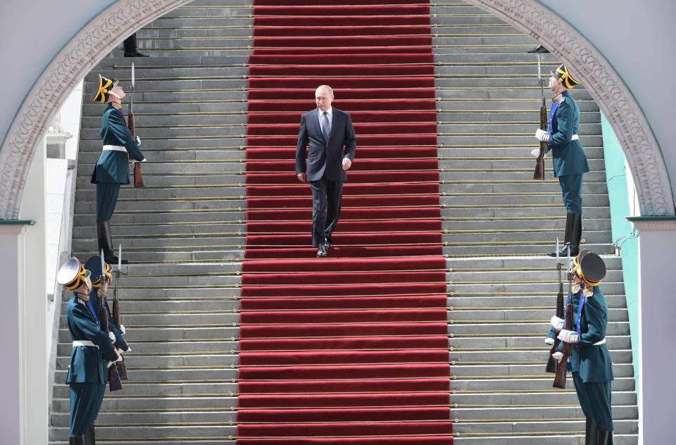 Russian President Vladimir Putin (C) walks down the stairs after his inauguration ceremony in the Cathedral Square in the Kremlin in Moscow, Russia, 07 May 2018. Source: EPA/AAP