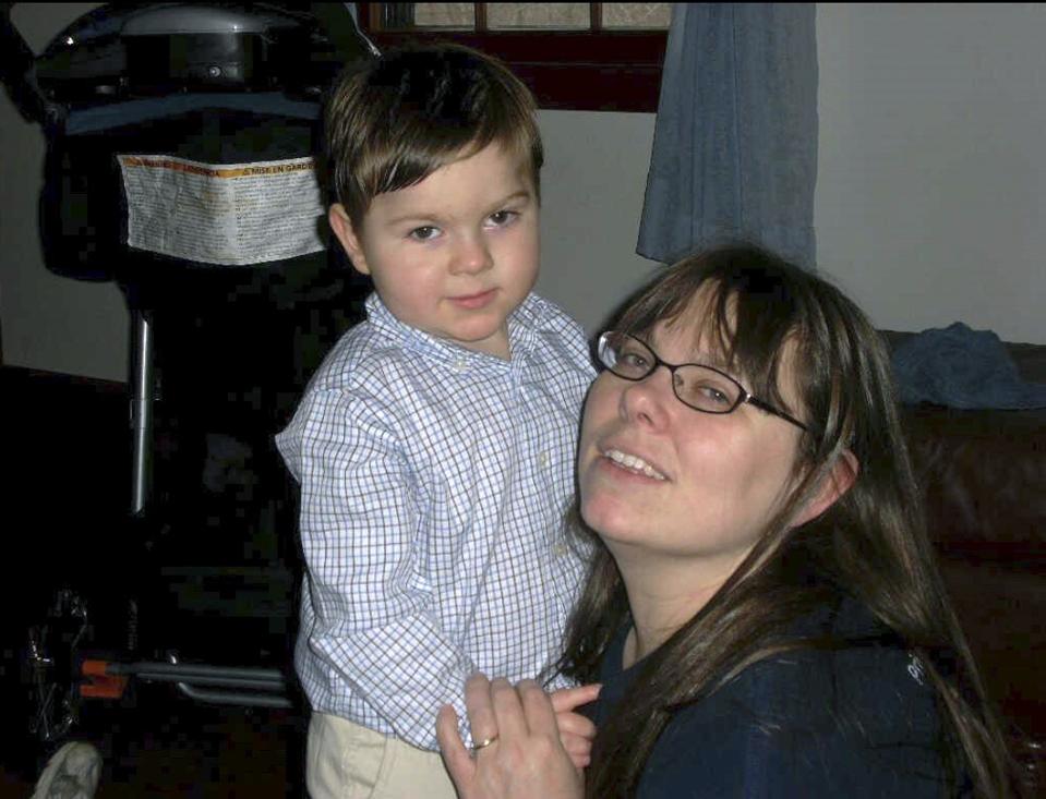 This undated photo provided by Regan Lamphier shows Lamphier, of Nashua, N.H., with her late son Ethan, who died when he was eight. Unlike workers covered under some state laws, federal employees will not get paid leave for their own serious illness or to care for a sick relative. More than 70% of the time, those the reasons workers take time off under the 1993 Family and Medical Leave Act, which only guarantees unpaid leave. That coverage would have made a big difference for Lamphier. (Bill Lamphier via AP)