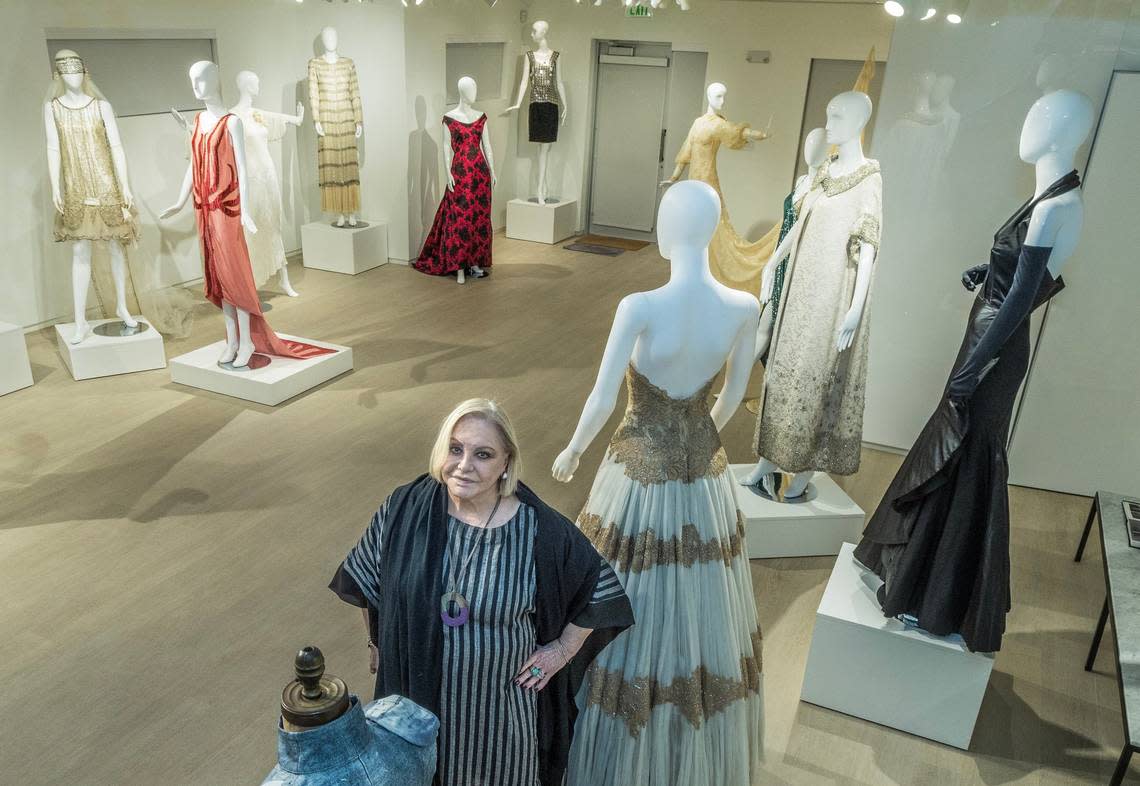 Paquita Parodi, collector and restorer of antique dresses, founded Parodi Costume Collection in Miami, where she exhibits her more than 5,000 pieces and hosts fashion design students in a restored house in Wynwood. Parodi poses next to a 1958 dress designed by Fernanda Gattinoni, worn by actress Sofia Loren, and another from the “Flamenco” series, by Spanish designer Cristóbal Balenciaga, worn by Dolores del Río. Pedro Portal/pportal@miamiherald.com