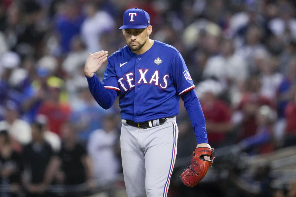 Texas Rangers starting pitcher Nathan Eovaldi reacts against the Texas Rangers during the fourth inning in Game 5 of the baseball World Series Wednesday, Nov. 1, 2023, in Phoenix. (AP Photo/Godofredo A. Vásquez)