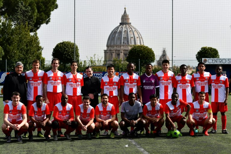 Deogratias (2ndL, 1st row) poses with his team Sedes Sapientiae