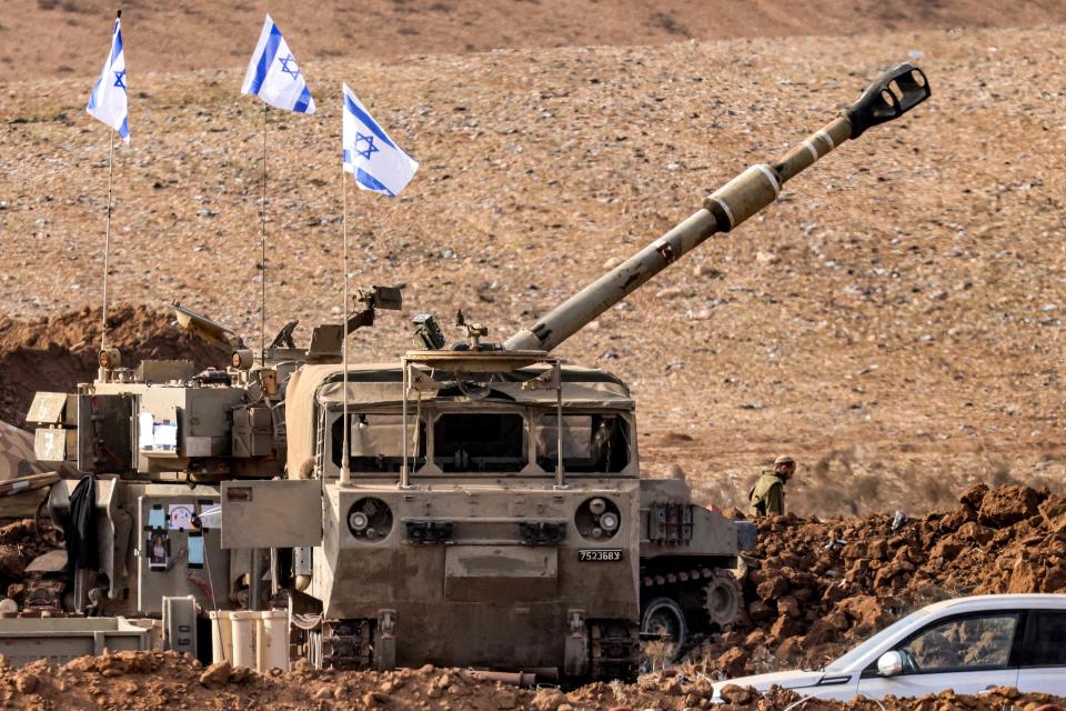 An Israeli army M109 155mm self-propelled howitzer is deployed at a position along the border with the Gaza Strip near Sderot in southern Israel on October 27, 2023 amid ongoing battles between Israel and the Hamas.
(Credit: JACK GUEZ, AFP via Getty Images)