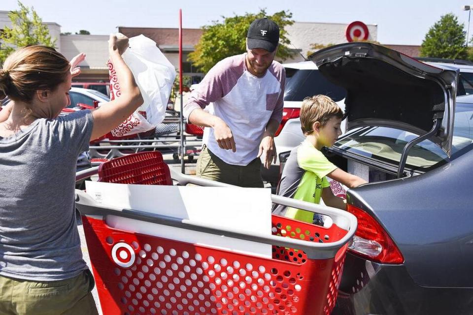 Shoppers fill their carts with items that are tax free this weekend during the annual back-to-school event where parents, students and even regular folk can save a bit of money by taking advantage of the savings. Here, a family loads their trunk on Aug. 6, 2016, after saving money on the tax free shopping day. From left, Kathleen Profitt, a teacher at E. L. Wright Elementary, Zak Profitt, a teacher a A.C. Flora High School and their fourth grader son Dexter Wilkinson. Rob Thompson/rthompson@thestate.com