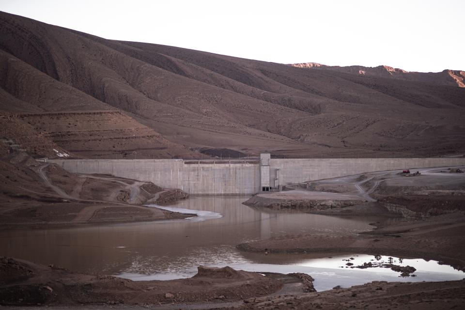 Low water levels are visible near the Todgha dam near Tinghir, Morocco, Sunday, Nov. 27, 2022. The centuries-old oases that have been a trademark of Morocco are under threat from climate change, which has created an emergency for the kingdom's agriculture. (AP Photo/Mosa'ab Elshamy)