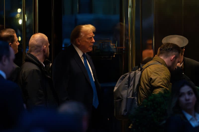 Republican presidential candidate and former U.S. President Donald Trump steps out to greet Polish President Andrzej Duda at Trump Tower in New York