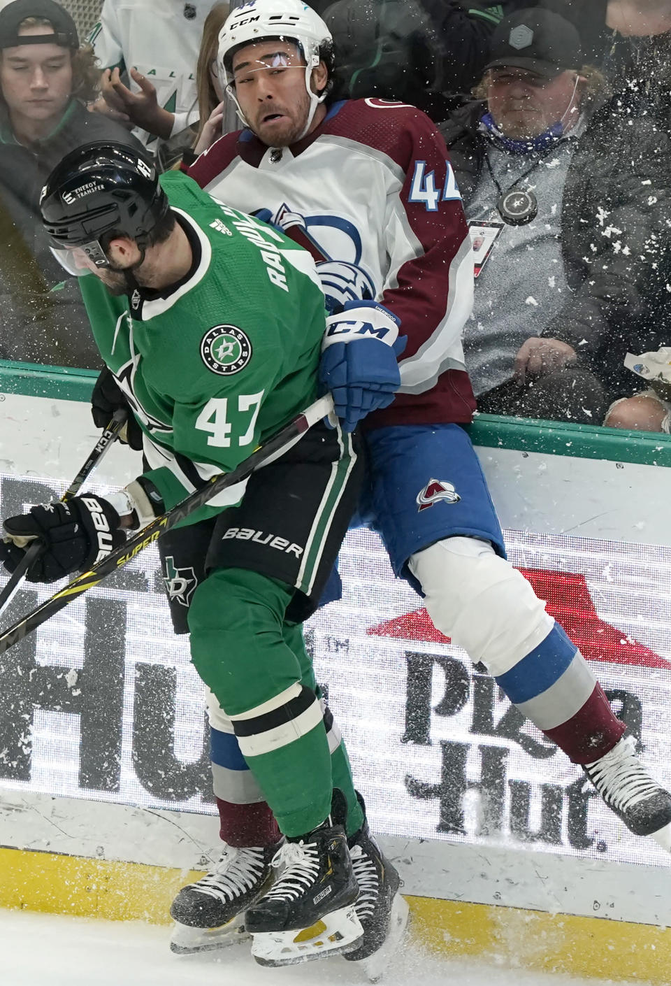 Colorado Avalanche left wing Kiefer Sherwood (44) is checked into the boards by Dallas Stars right wing Alexander Radulov (47) during the first period of an NHL hockey game in Dallas, Friday, Nov. 26, 2021. (AP Photo/LM Otero)