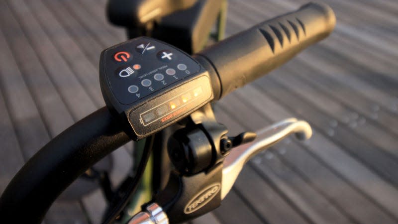 A photo of the brake and control panel on the RadRunner 2 electric bike. 