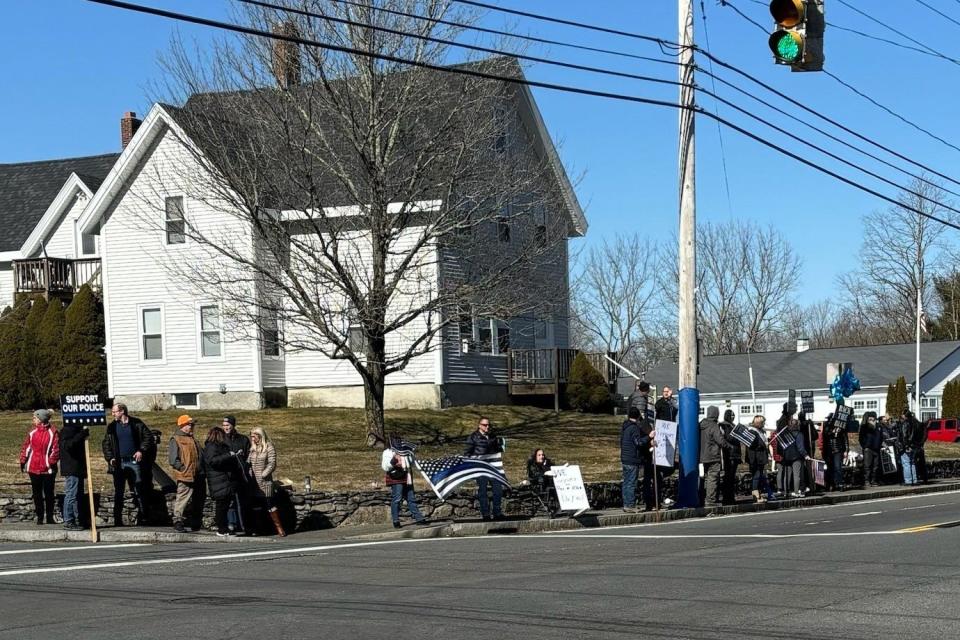 Dighton residents hold a "back the blue" rally on Sunday, Feb. 25, 2024, at at the corner of Route 138 and Center Street to protest the hiring process for Dighton's next police chief.