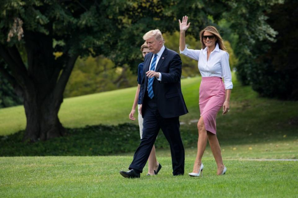 <p>The president and first lady head to Air Force One for a trip to Trump National Golf Club in Bedminster, NJ for the 4th of July weekend. Melania looked festive with a classic white collared shirt, a red and white checkered skirt, and (if you notice) pale blue stilettos. </p>