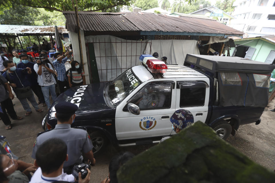 A police vehicle carrying Canadian pastor David Lah leaves a township court after a hearing Thursday, Aug. 6, 2020, in Yangon, Myanmar. The court has sentenced Lah to three months imprisonment after finding him guilty of violating a law intended to combat the spread of the coronavirus. (AP Photo/Thein Zaw)