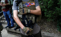 <p><span>A member of a white supremacists militia stands near a rally in Charlottesville, Virginia, U.S., August 12, 2017. (Photo: Joshua Roberts/Reuters)</span> </p>