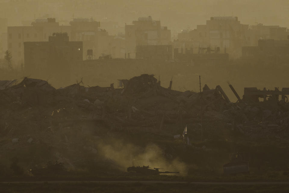 An Israeli army tank moves in the Gaza Strip, as seen from southern Israel, Tuesday, March 5, 2024. (AP Photo/Leo Correa)