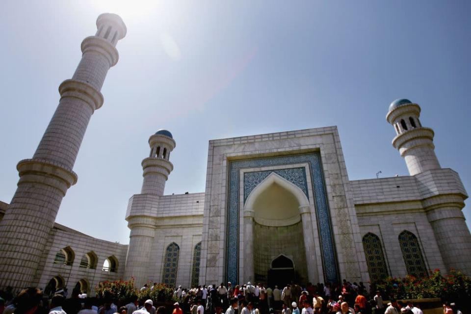 <b>ALMATY, KAZAKHSTAN:</b> Islamic worshippers gather outside the Great Mosque during Friday Muslim prayers in Almaty in the central Asian republic of Kazakhstan. It was completed in 1999 after six years of construction on the site of an old mosque. Under Soviet communist rule, religion was suppressed in Kazakhstan and many other countries of the former USSR.