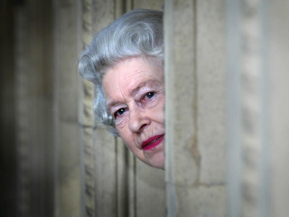 Queen Elizabeth peeks around a corner