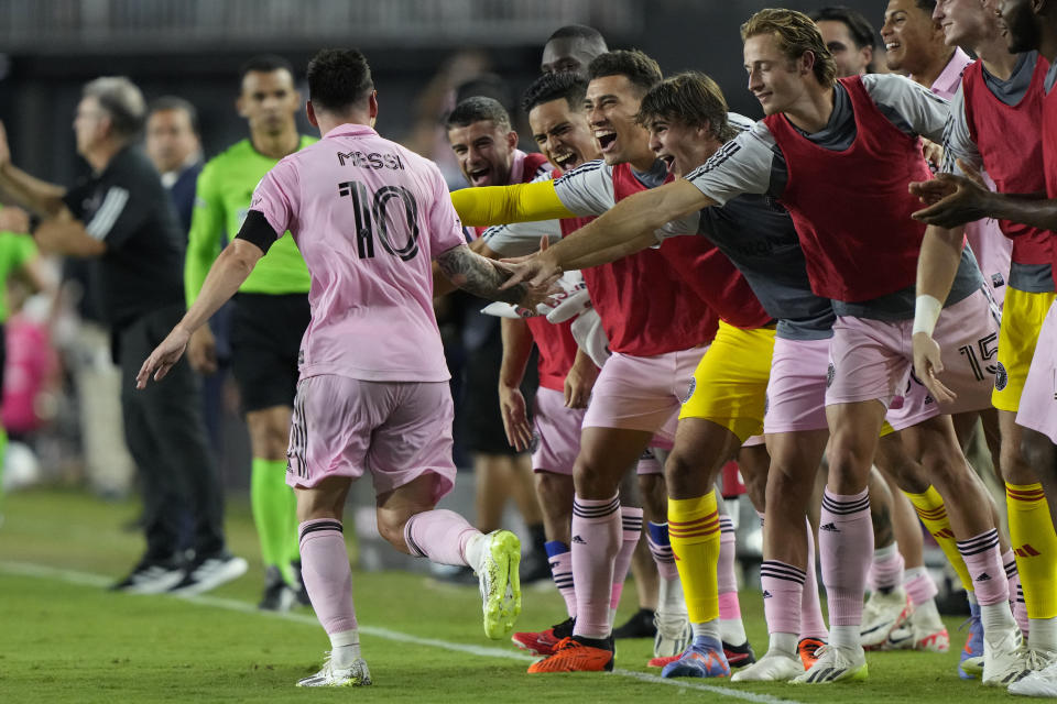 Inter Miami forward Lionel Messi (10) celebrates with the team after scoring late in the second half of a Leagues Cup soccer match against Cruz Azul, Friday, July 21, 2023, in Fort Lauderdale, Fla. Inter Miami defeated Cruz Azul 2-1. (AP Photo/Lynne Sladky)