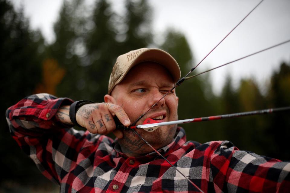 Jason Van Tatenhove, a member of the Oath Keepers, practices archery at his home in northern Montana, U.S. September 25, 2016.