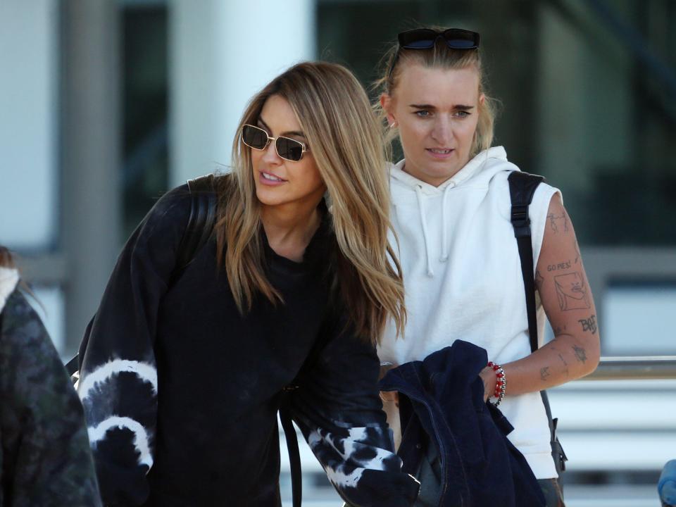 G Flip and Chrishell Stause arrive at Perth Airport on January 7, 2023, in Perth, Australia.